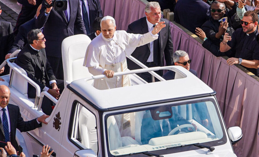 Pope_Leo_XIV_in_the_popemobile_at_his_inauguration_(cropped)